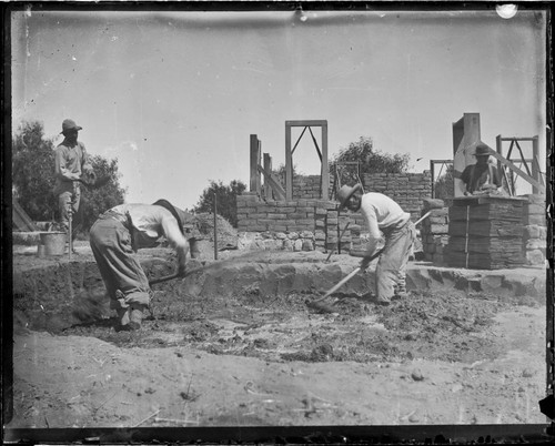 Indians building adobe house for Bro. Weinland