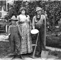 Woman with two boys dressed as gold prospectors