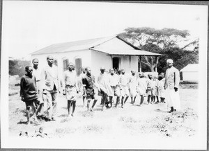 Teacher Ndelizo with students, Arusha, Tanzania, 1929