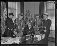 J. J. Engbrecht, Sergeant Joseph O. Dircks, Sergeant M. E. Wheeler, Motor Officer Lee J. Young and Detective Lieutenant Emmett E. Jones surround Chief of Police James E. Davis, Los Angeles, 1936