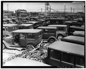Old automobiles parked in a junkyard on South Main Street, Los Angeles, ca.1940