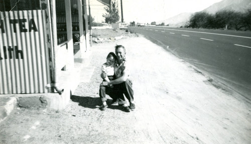Harold Embshoff and his son, Hal, posing in front of their fruit and vegetable store at 1865 W. Ramsey Street in Banning, California
