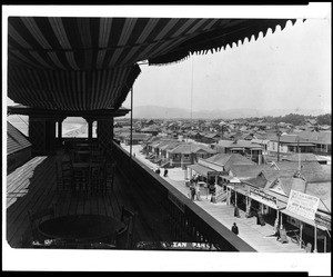 View from the second story of a pavillion on the Ocean Park pier, showing shops and beach houses, ca.1915