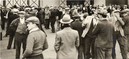[Crowd of longshoremen assembled at waterfront at end of 1934 strike]