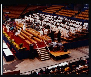 Women in white on stage at a COGIC national convention