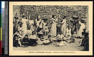 Missionary sister watches women preparing durra cakes, Harer, Ethiopia, ca.1900-1930