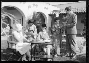 Serving tea at office on tract at Hollywood Riviera, Redondo Beach, CA, 1928