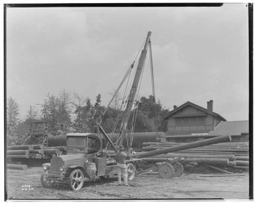 "Take Off" loading poles on "dolly" at the Whittier Railroad Station