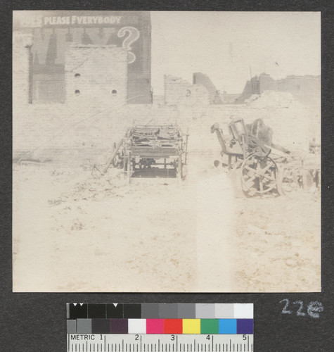 [Draying wagon (?) among ruins.]