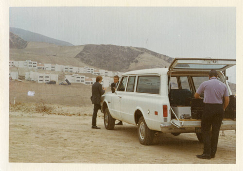 William Banowsky with station wagon at Malibu construction site, 1972
