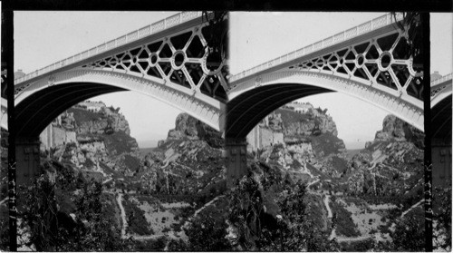 Looking up the gorge of the Rummel through a massive arch of modern bridge, Constantine, Algeria