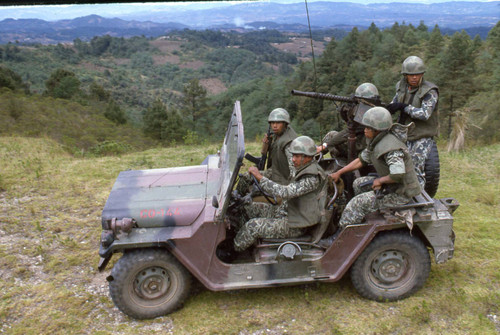 Soldiers in a jeep on patrol, Guatemala, 1982