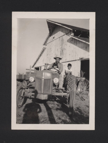 Farmer and children on tractor
