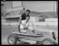 Race car drivers Rex Mays and Bob Swanson pose at the Legion Ascot speedway, Los Angeles, 1935