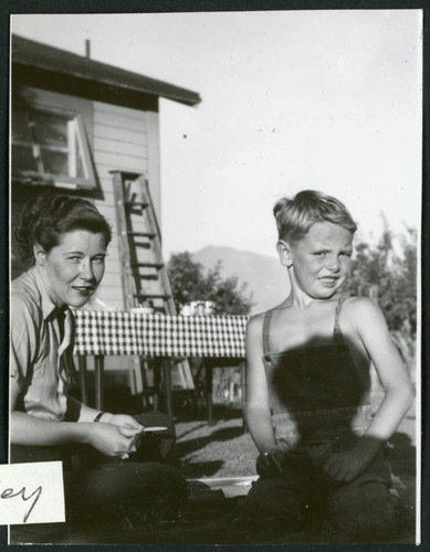 Photograph of Elizabeth Moxley and a young boy at Manzanar