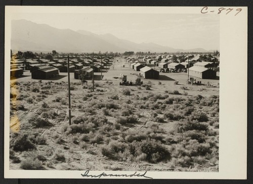 A view of the Manzanar Relocation Center showing streets and blocks. Photographer: Lange, Dorothea Manzanar, California