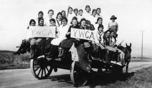 American Indian girls on wagon