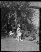 Three-year-old Rosita Dee Cornell standing in a yard, California, 1934