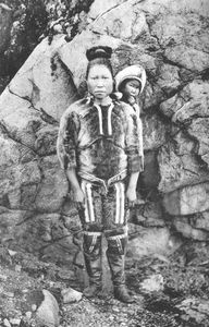East Greenland woman with his child on the back
