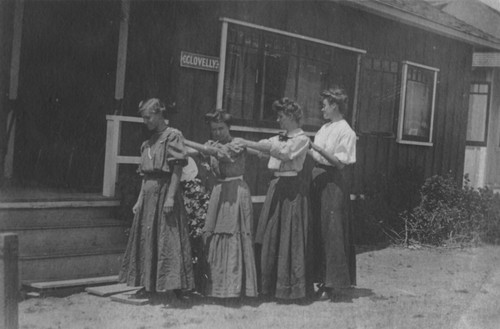 [Four women standing outside Clovelly cottage, La Jolla]