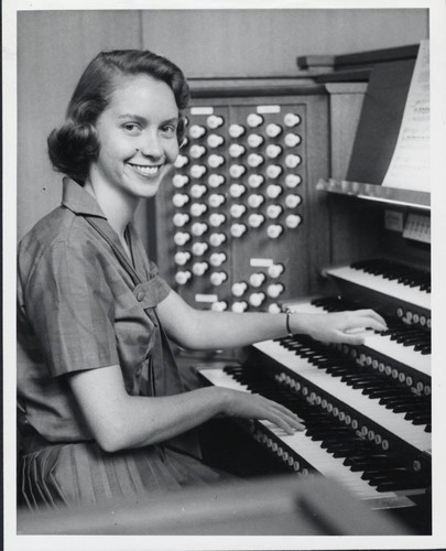 Woman plays organ, Scripps College