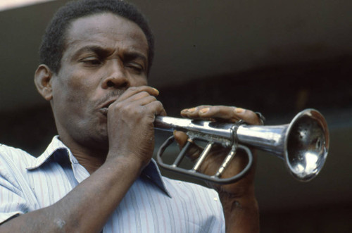 Man Playing the bugle at the Blacks and Whites Carnival, Nariño, Colombia, 1979