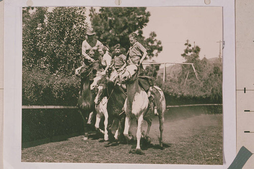 Will Rogers and his children riding and roping (left to right Will Sr,. Mary, Jim, and Will Jr.)
