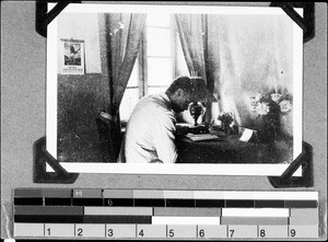 Brother Hauffe reading in his study, Utengule, Tanzania, ca.1934