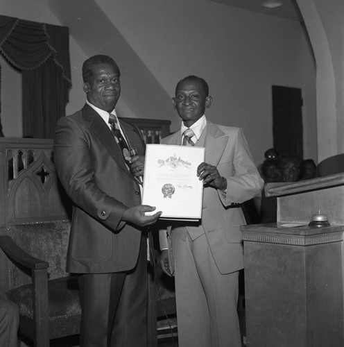 Bishop Barnes receiving a commendation from Mayor Bradley, Los Angeles, 1976