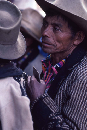 A Mayan man waits in line to vote, Guatemala, 1982