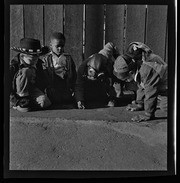 Group of children drawing on the ground, California Labor School
