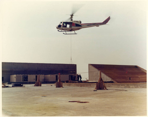 Helicopter airlift during Malibu construction, 1972