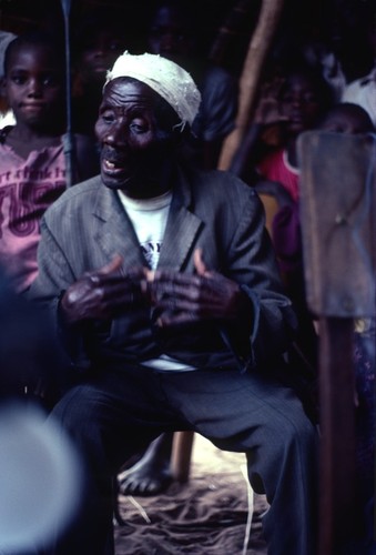 Mr. Chishele Chuulu performing an oral history at Chief Kaputa's compound, Kaputa village