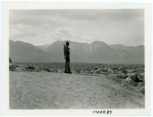 Photograph of a sentry guard at Manzanar incarceration camp