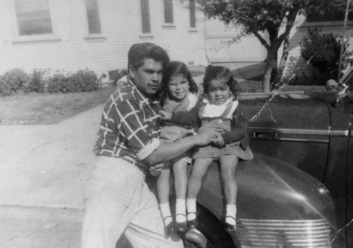Mexican American father with daughters