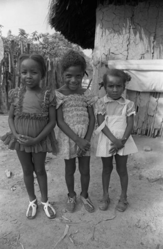 Three girls standing together, San Basilio de Palenque, 1976