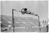High-jumper completing a jump at a track meet between UCLA and USC, Los Angeles, 1937