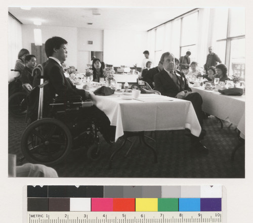 Kurt Lauridsen, Johnson Chu and unidentified people sitting at some sort of a reception