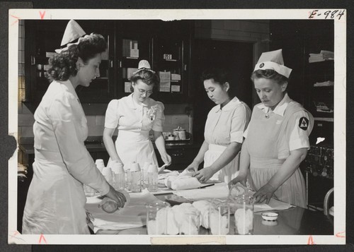 Ella Ito (third from left) and her co-workers prepare plasma containers for the blood bank at New York's world famous