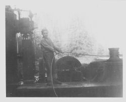 Young Bob Sturgeon working steam donkey spool at Sturgeon's Sawmill