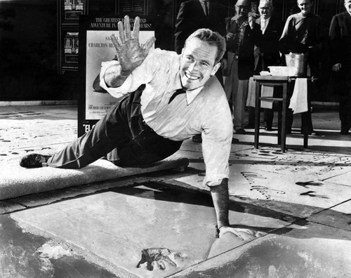 Actor Charlton Heston puts his prints in concrete