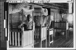 Nun working with infants at a hospital, Solomon Islands, Oceania, 1938