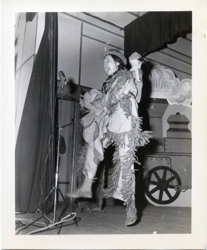 Performer in Indian costume during an Eighth Army base musical review in Korea