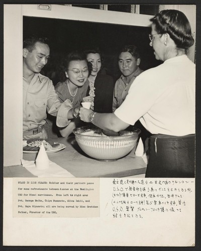 Soldiers and their partners pause for some refreshment between dances at the Washington USO for Nisei servicemen. From left to