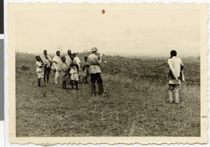 Wassmann blowing a trumpet, Korme, Ethiopia, 1952