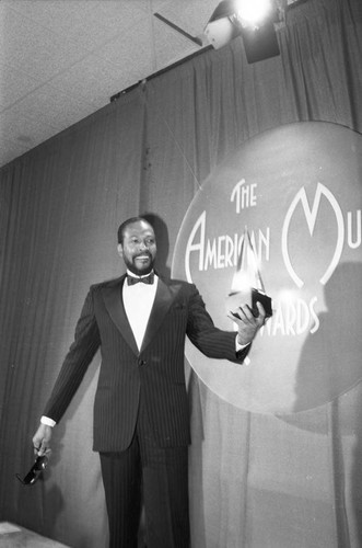 Marvin Gaye posing with his award at the 10th Annual American Music Awards, Los Angeles, 1983