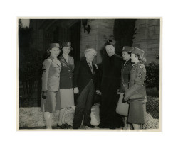 Isidore B. Dockweiler with WAC personnel and Roman Catholic priest, circa early 1940s