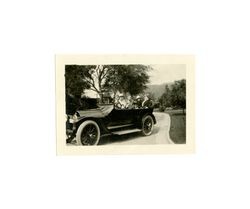 John Francis Dockweiler and three women in a car