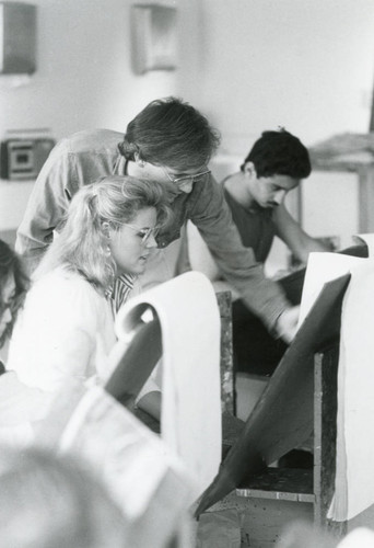Art professor Joe Piasentin with student, circa 1985
