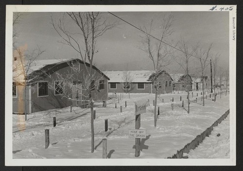 A review of the administrative area after a December storm. At the left is the post office and the two buildings to the right are administrative office buildings. Photographer: McClelland, Joe Amache, Colorado